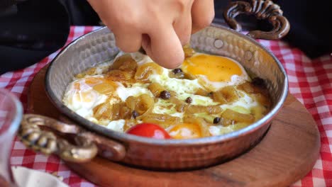 turkish breakfast with fried eggs and onions