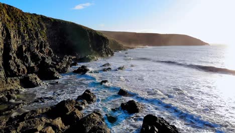 Beach-with-mountain-cliff-and-sea-4k