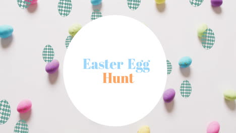 animation of easter egg hunt text over colourful easter eggs on white background