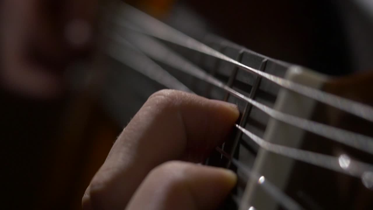 Close-up of someone playing a guitar