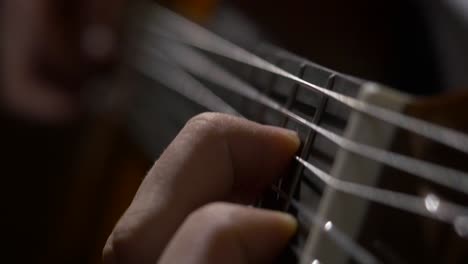 close-up of someone playing a guitar