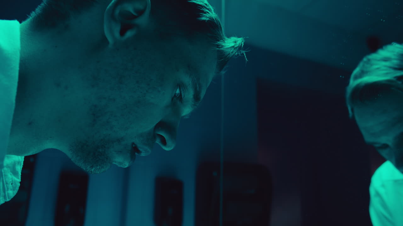 Man Looking at His Reflection, Sad and Disappointed