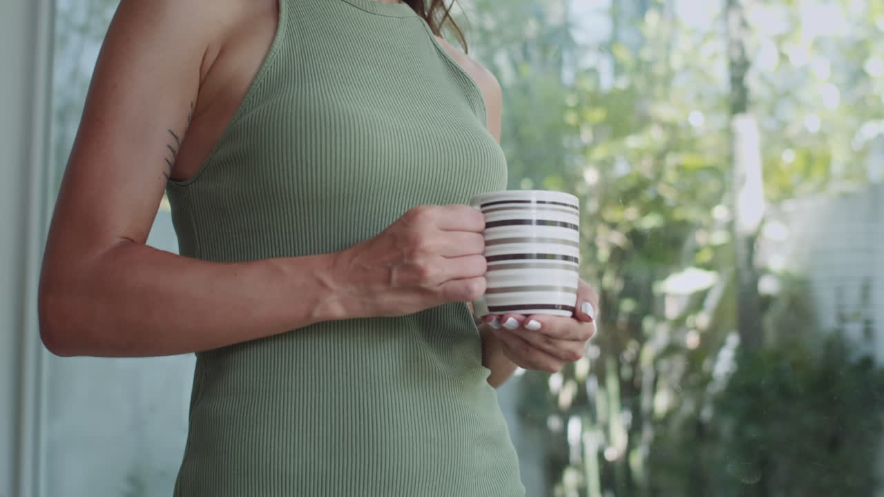 Woman Having Coffee for Breakfast at Home