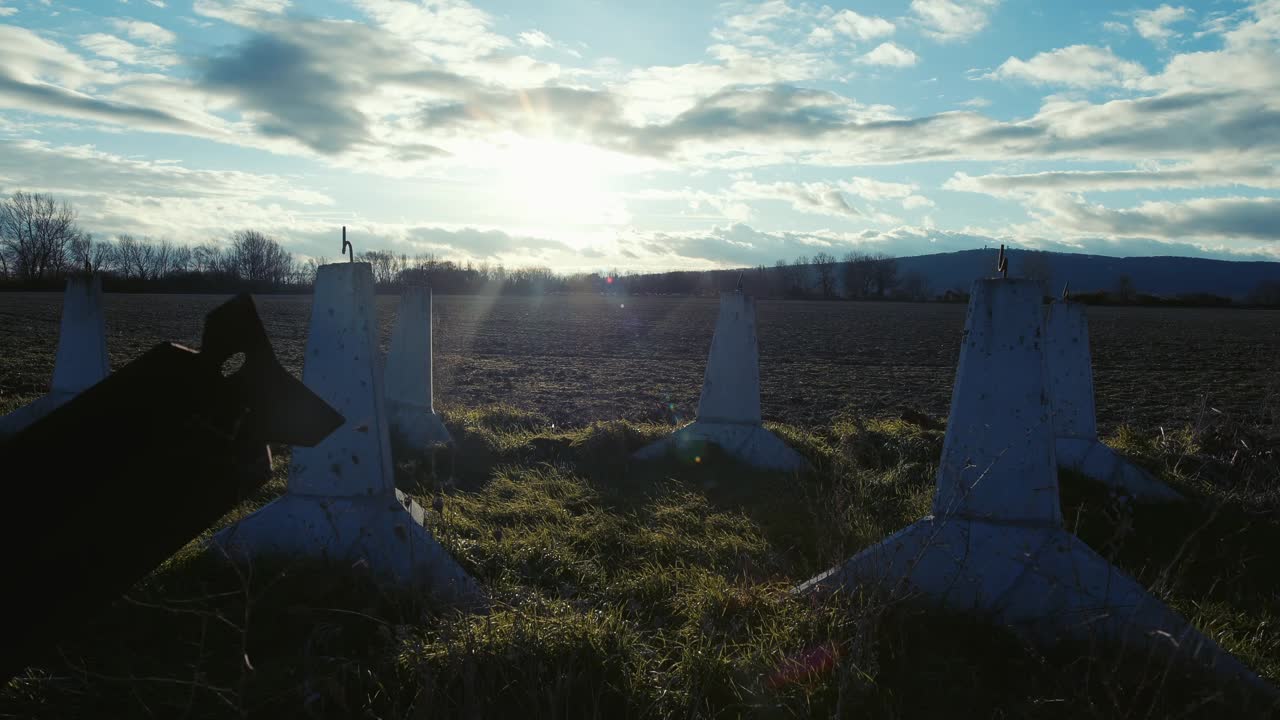 Close shot of old anti tank concrete pylons near historic war site.