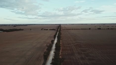 aerial footage at sunset over country track near berriwillock, victoria, australia, may 2021