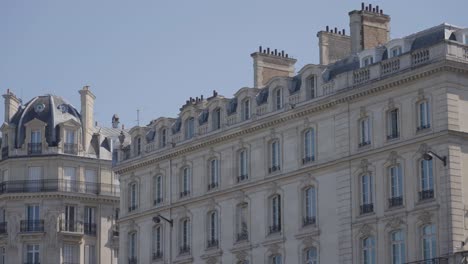 close up of apartment blocks in paris france viewed from river seine in slow motion