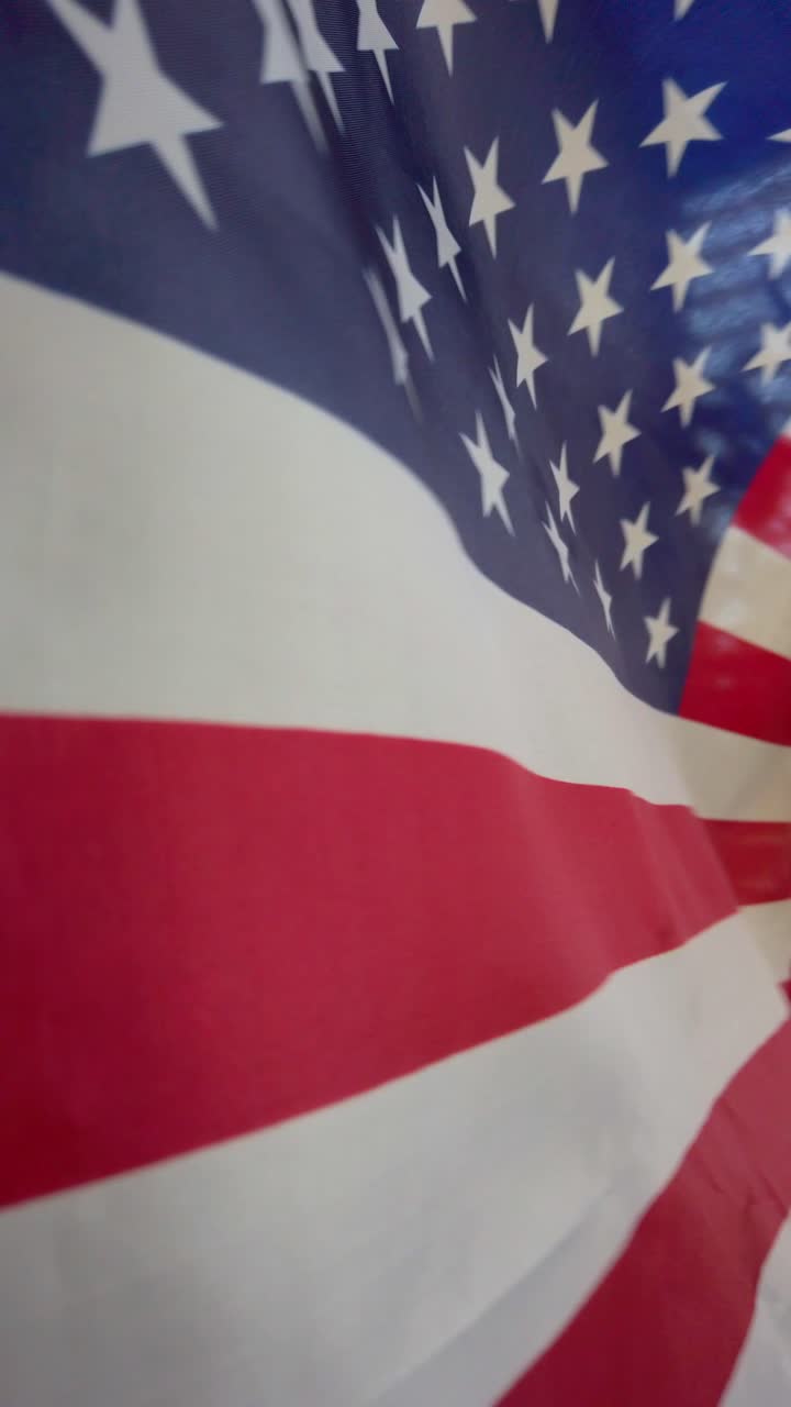 Close-up view of six American flags waving