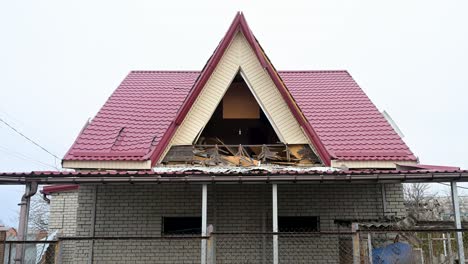 a view of a damaged home and roof in a village near kramatorsk, ukraine, following a russian missile attack. the destroyed roof is a common sight in areas targeted by shelling