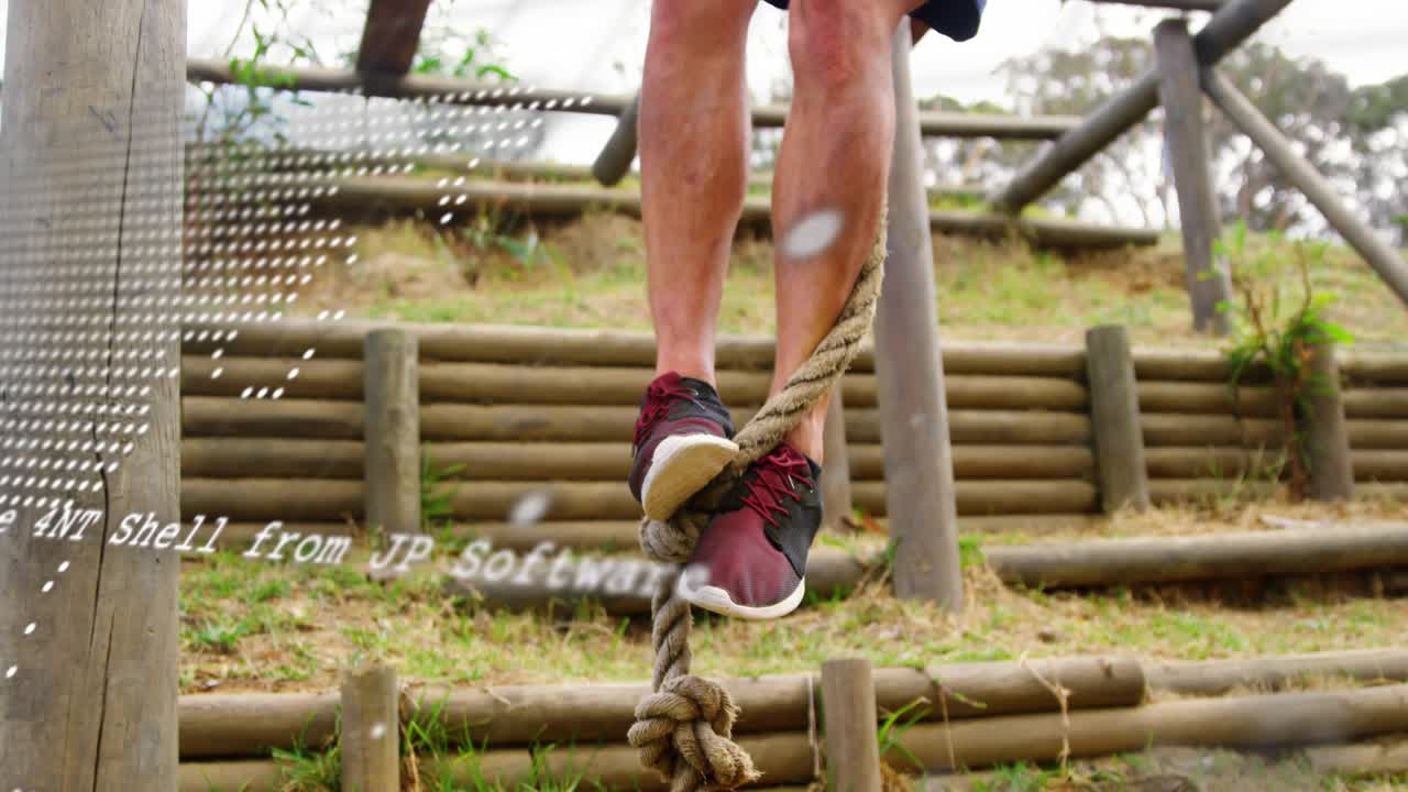 Male climber ascending rope on fitness course for reaching top, map overlay scrolling and fading