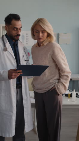 doctor consulting with patient in clinic