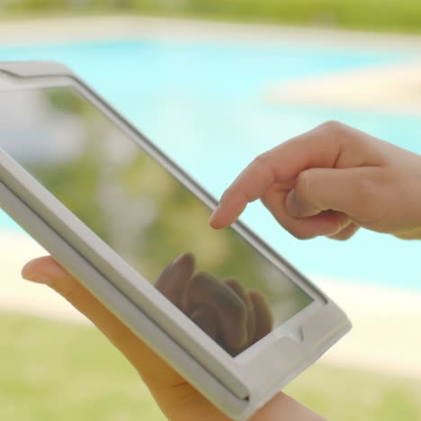 Close-Up-on-Woman-Hands-While-Using-Tablet