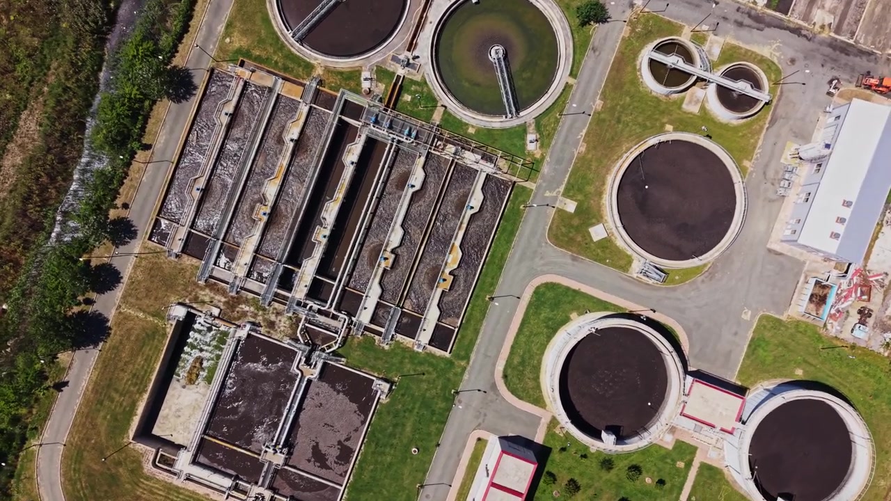 Wastewater treatment facility in operation with round tanks and channels