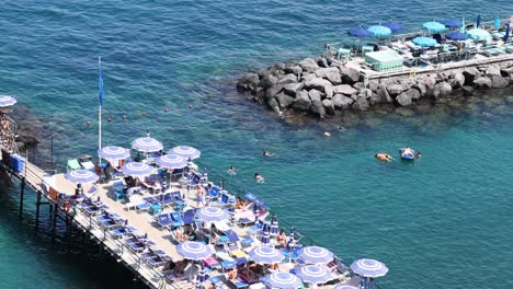 people relaxing and swimming at leonelli beach