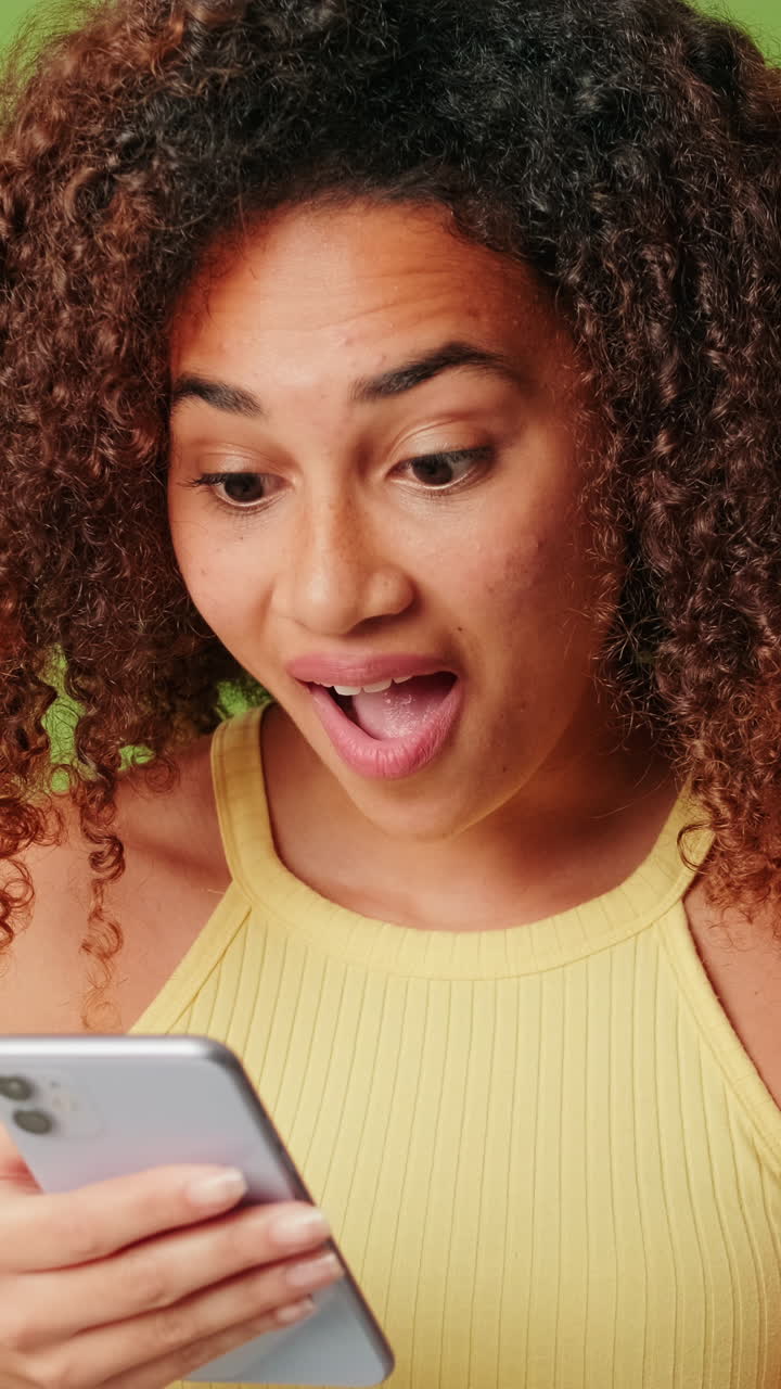 Woman reacts to content on her smartphone