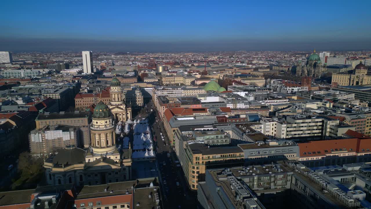 Berlin Gendarmenmarkt square including german Dom and French Dom from an aerial perspective. Perfect aerial view rotation pan to left drone