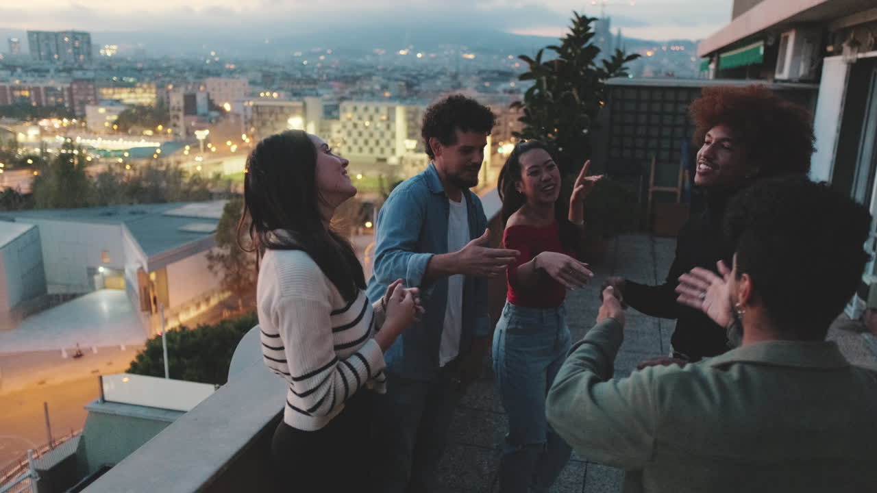 Friends enjoying a rooftop party at night