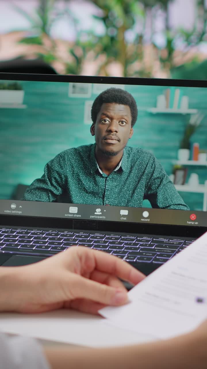 Vertical Video HR recruiter hosting interview with applicant via internet teleconference call