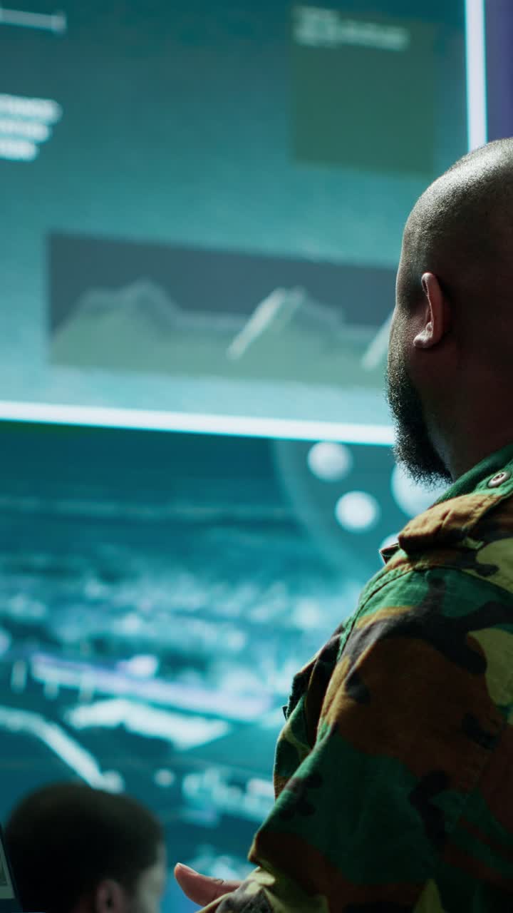 Vertical Video Military officer oversees surveillance and cybersecurity operations