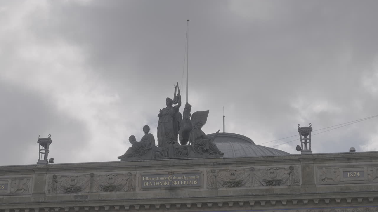 Statues on the roof of the Royal Danish Theatre in Copenhagen Denmark LOG