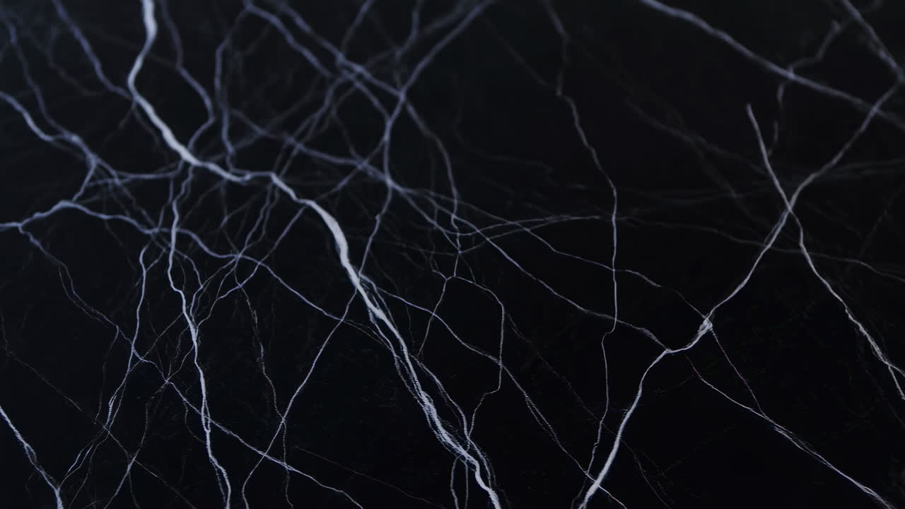 Moving Close-Up of Black Marble Texture with White Veins