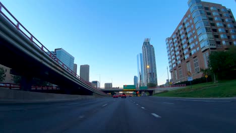 driving on a city highway at dusk