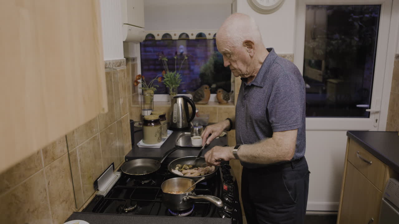 Elderly man cooking in the kitchen