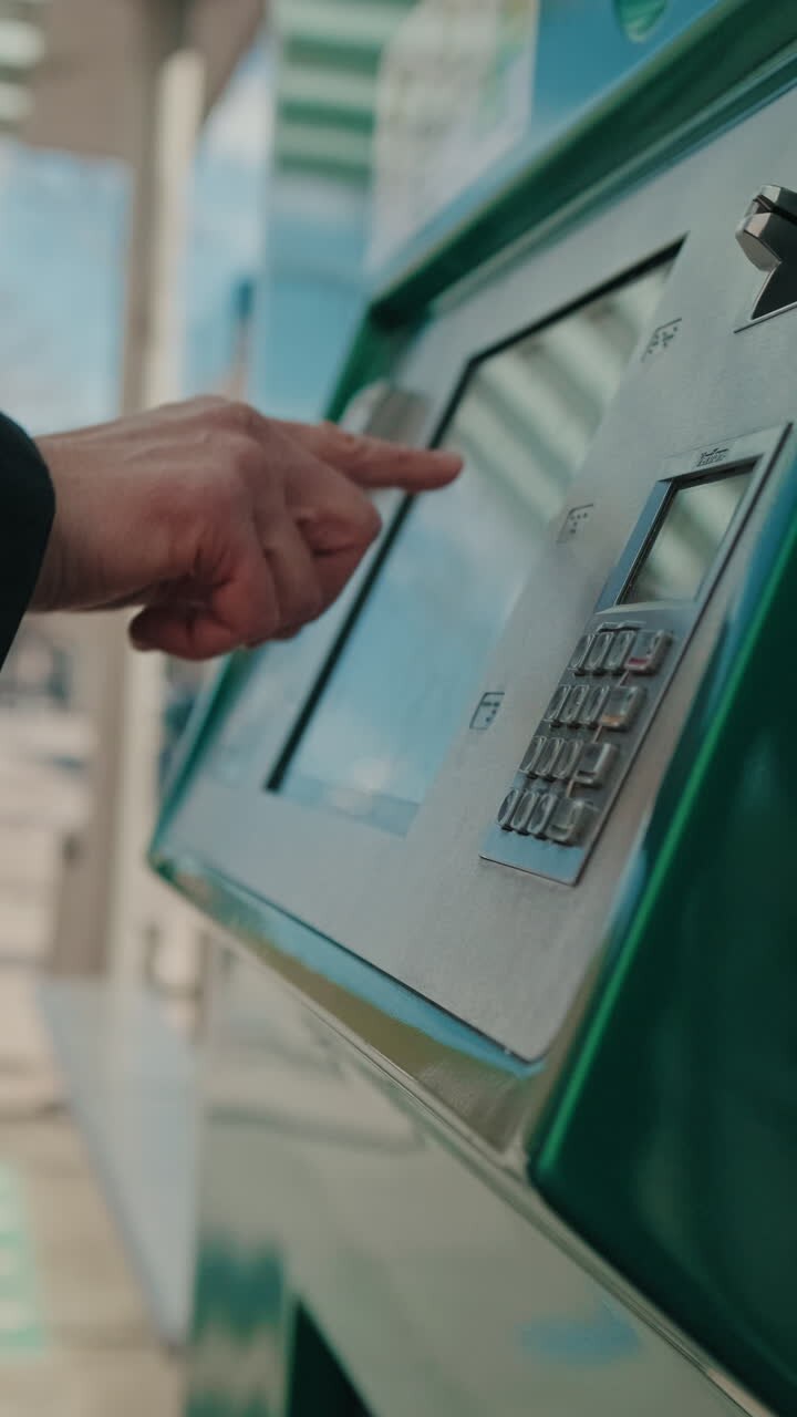 Person Using Ticket Vending Machine, male hand