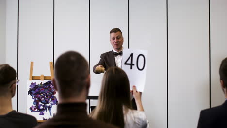 people in an art auction session