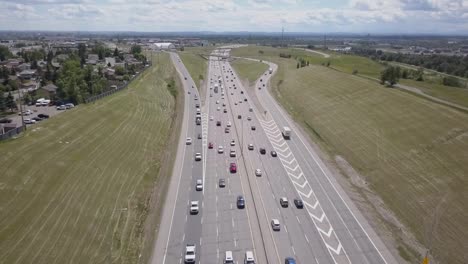 an urban  freeway with traffic and greenspace