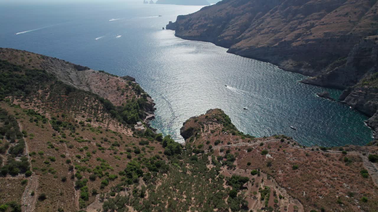 Aerial backwards view of Ieranto buy. Salerno gulf. Italy. Daylight