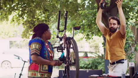 couple maintaining bicycle components