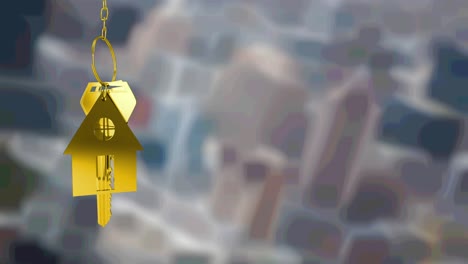 Animation-of-gold-house-key-fob-and-key,-hanging-in-front-of-blurred-city-buildings