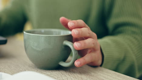 mug tapping, coffee and hand at a table for remote