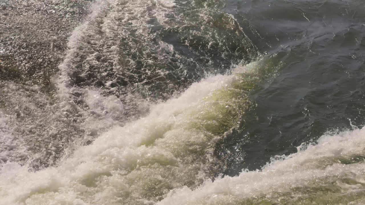 Close shot of fast flowing river waterfall