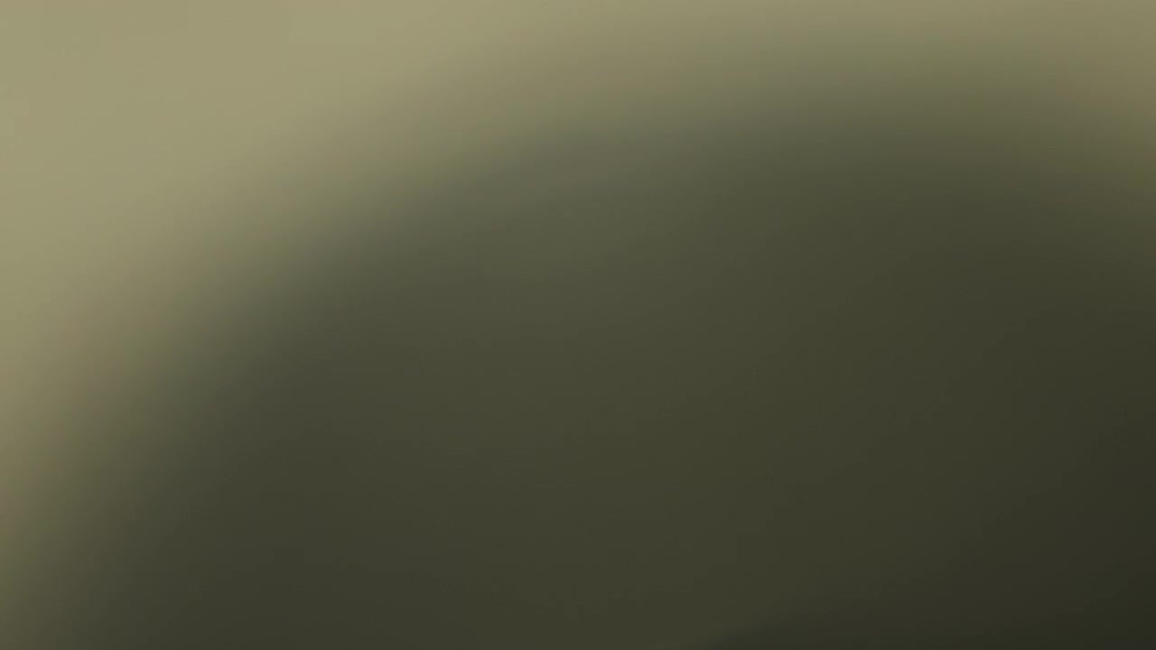 Abstract lens flare fading out to black background