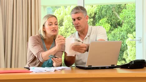 couple calculating bills