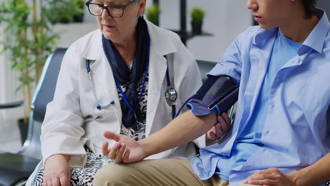 Doctor Checking Patient's Blood Pressure