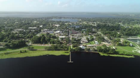 "clermont, fl - usa - 8-24-2020: bird's eye view push in shot towards downtown clermont