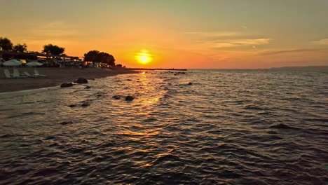 Colorful sunset on Mediterranean sea beach in Crete, Greece