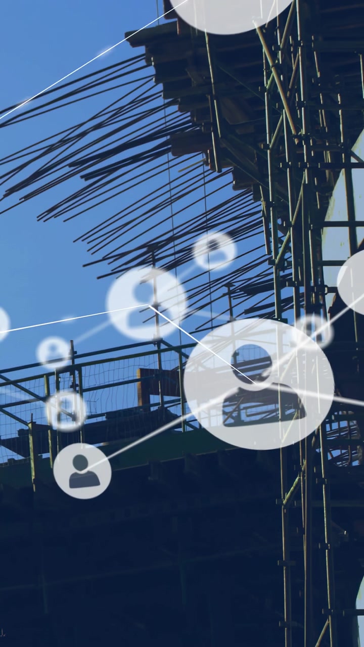Vertical video: Construction crew stepping back from platform, user nodes linking across rebar