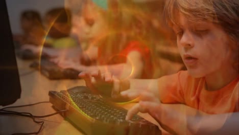 animation of smoke and circles over happy caucasian boy using computer