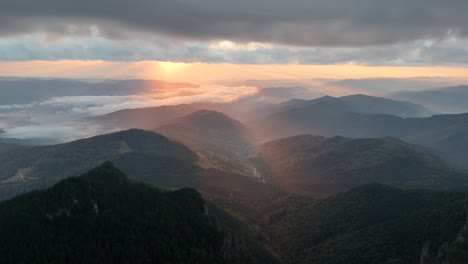 drone shot at sunrise near dochia chalet, ceahlău mountains,