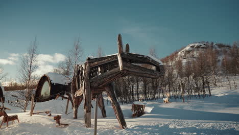 Slow-motion-shot-of-reindeer-sculpture-made-out-of-wood-in-Kirkenes-in-Norway-,-above-the-Arctic-circle