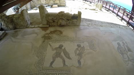 ancient mosaics depicting gladiators from the kourion archaeological site, cyprus