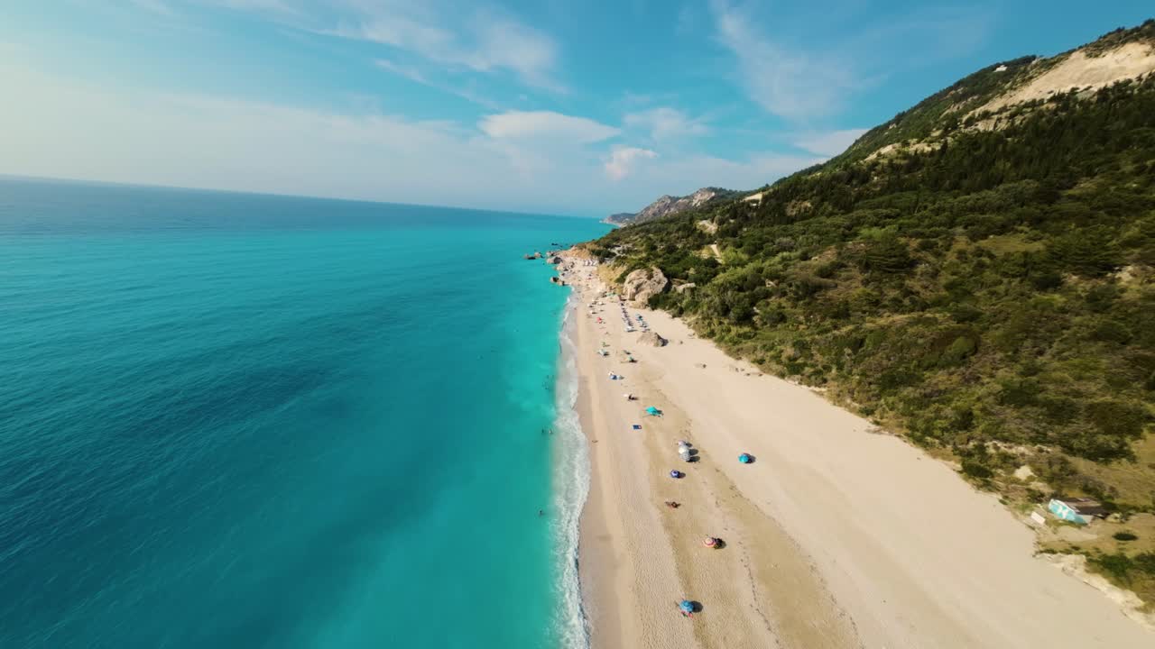 FPV drone flies over Megali petra beach in Lefkada, Greece
