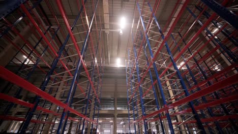 big and modern warehouse under construction, featuring metal shelving and other industrial equipment.