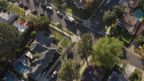 4K-cinematic-overhead-shot-of-houses,-apartments,-streets-and-palm-trees-in-Los-Angeles-California