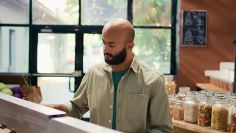 middle eastern man in eco food store