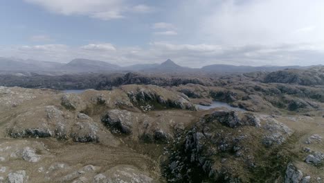 Aerial-moves-through-the-rocky-mountainous-landscape