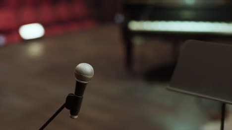 close-up of a microphone on a stand in a music studio